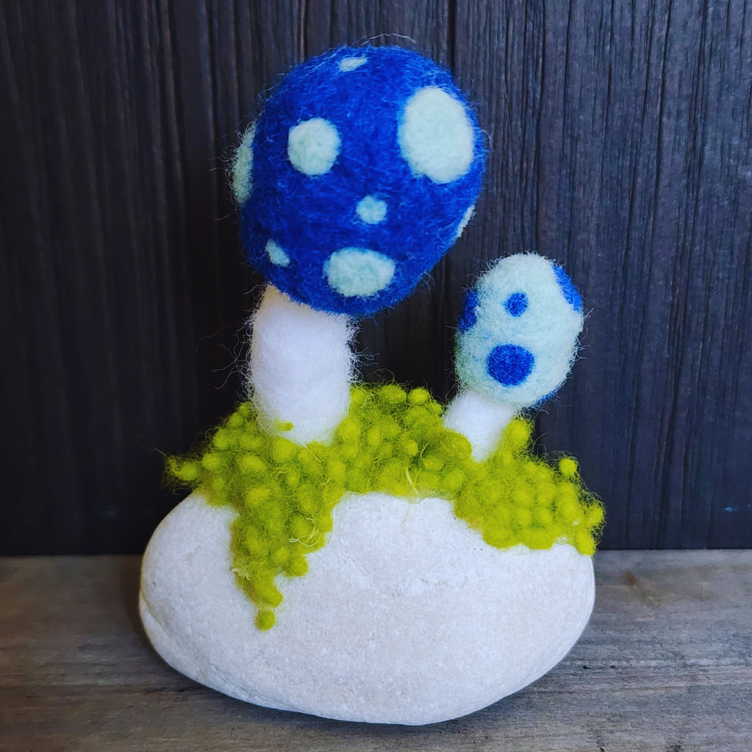 Handmade Felt Magic Mushrooms on White Granite Stone