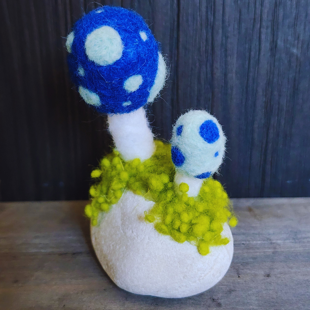 Handmade Felt Magic Mushrooms on White Granite Stone