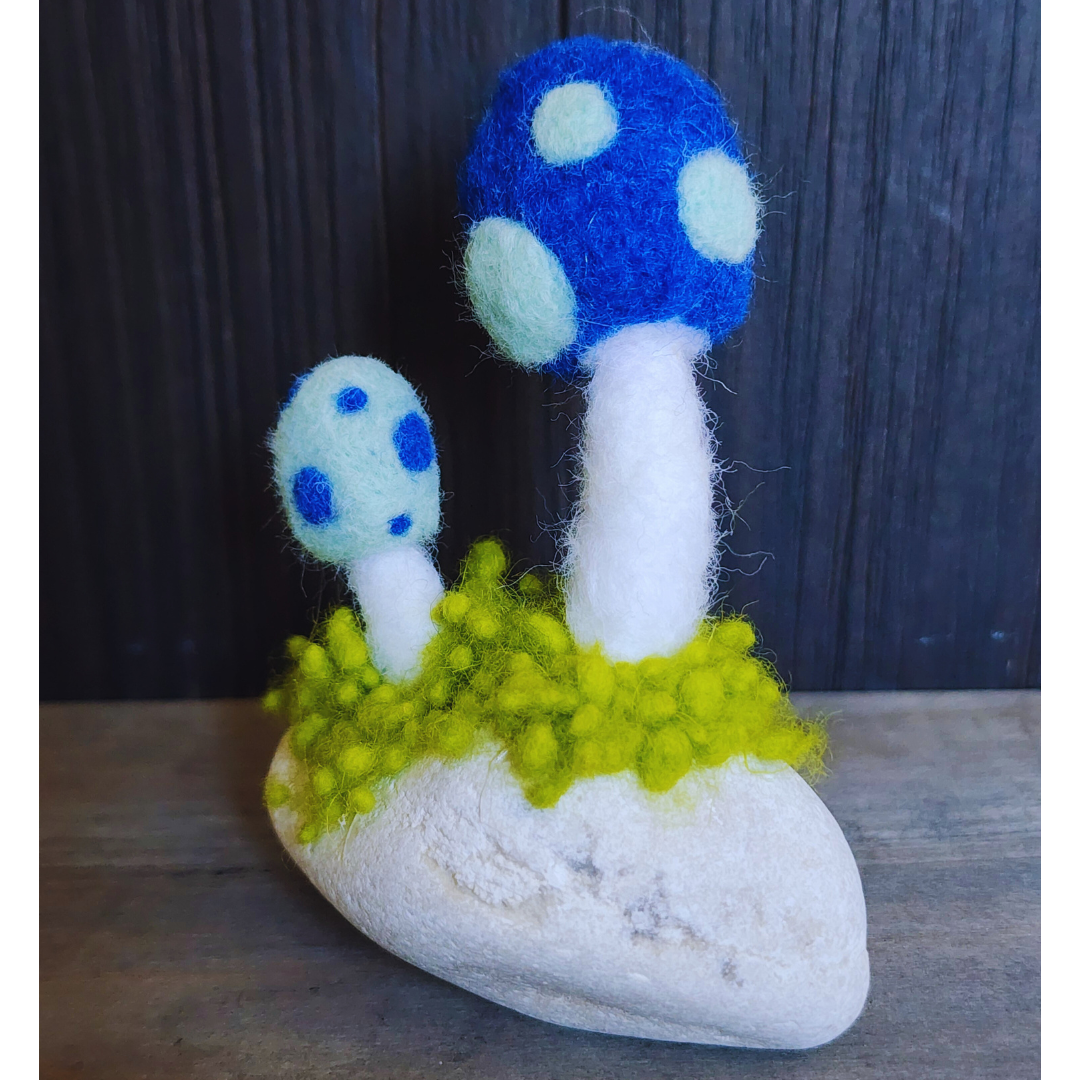 Handmade Felt Magic Mushrooms on White Granite Stone