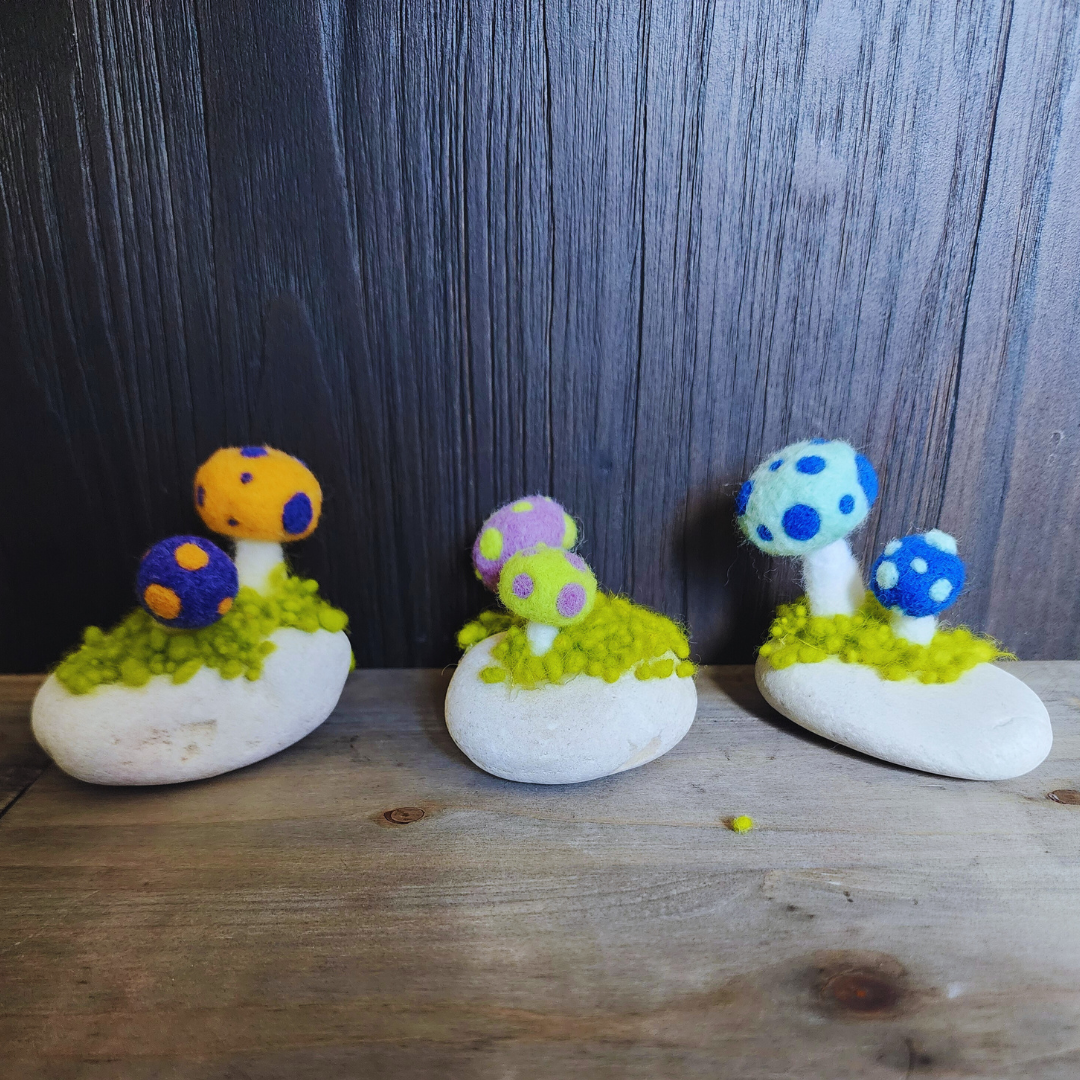 Handmade Felt Magic Mushrooms on White Granite Stone